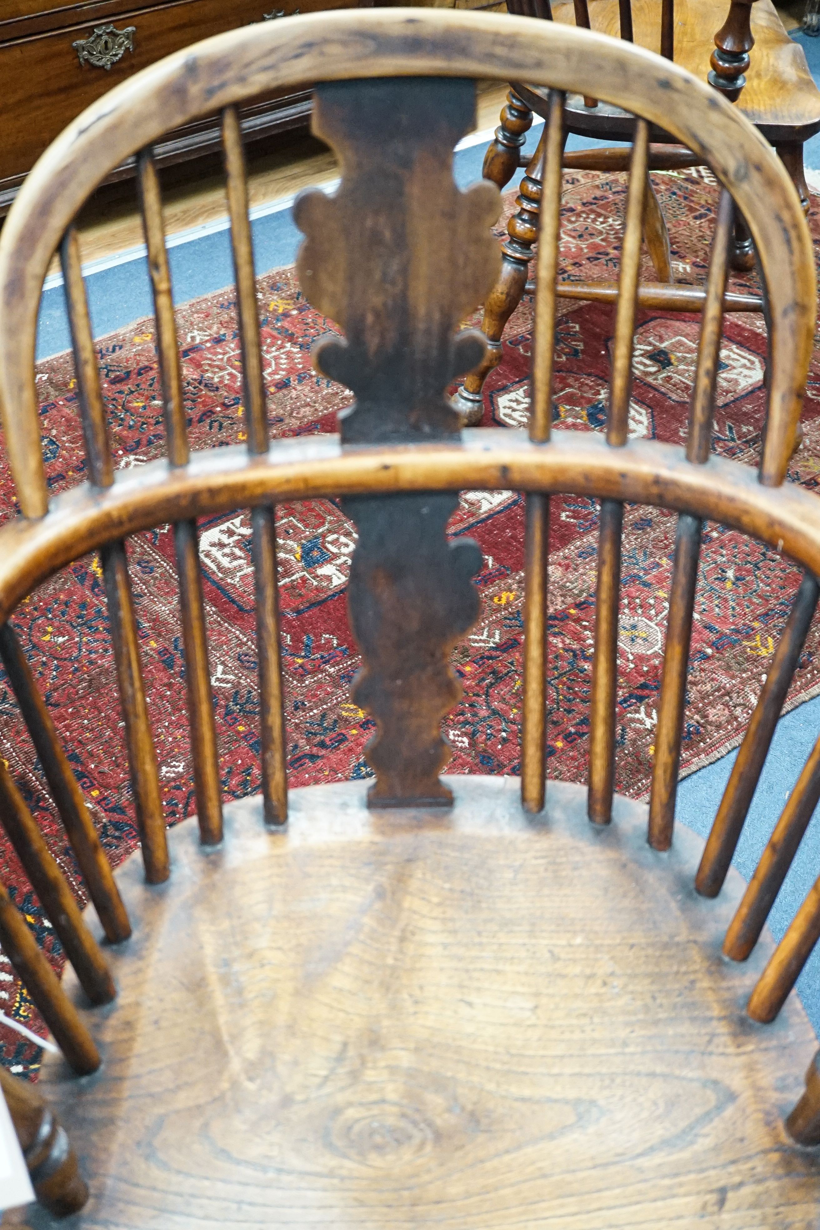 A 19th century yew and elm Windsor elbow chair with blind splat and crinoline stretcher, width 55cm, depth 40cm, height 93cm